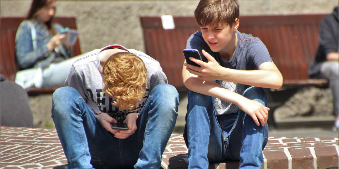 boys on phone - why screen time is bad parenting - Dynamic Dad